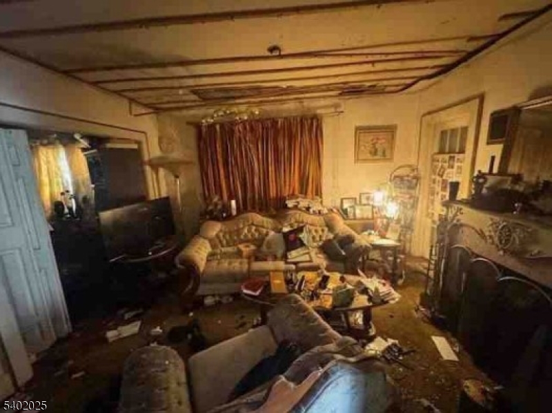 8 Arcadia Place Union, NJ 07088 - Photo 3 of 4 a view of walk in closet with clothes and shoes