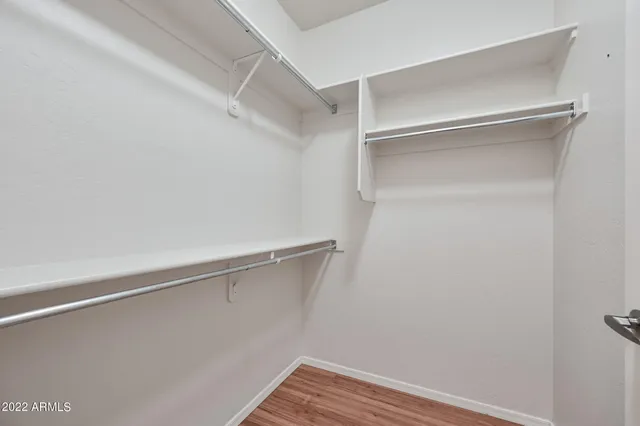 a view of an empty walk in closet