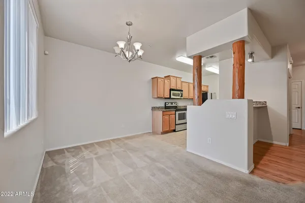 a view of kitchen with furniture and wooden floor