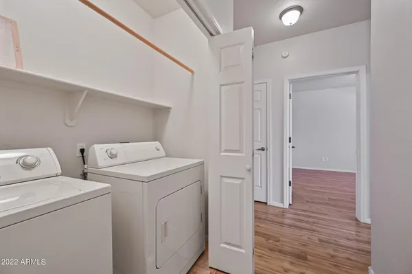 a view of storage and utility room with washer and dryer