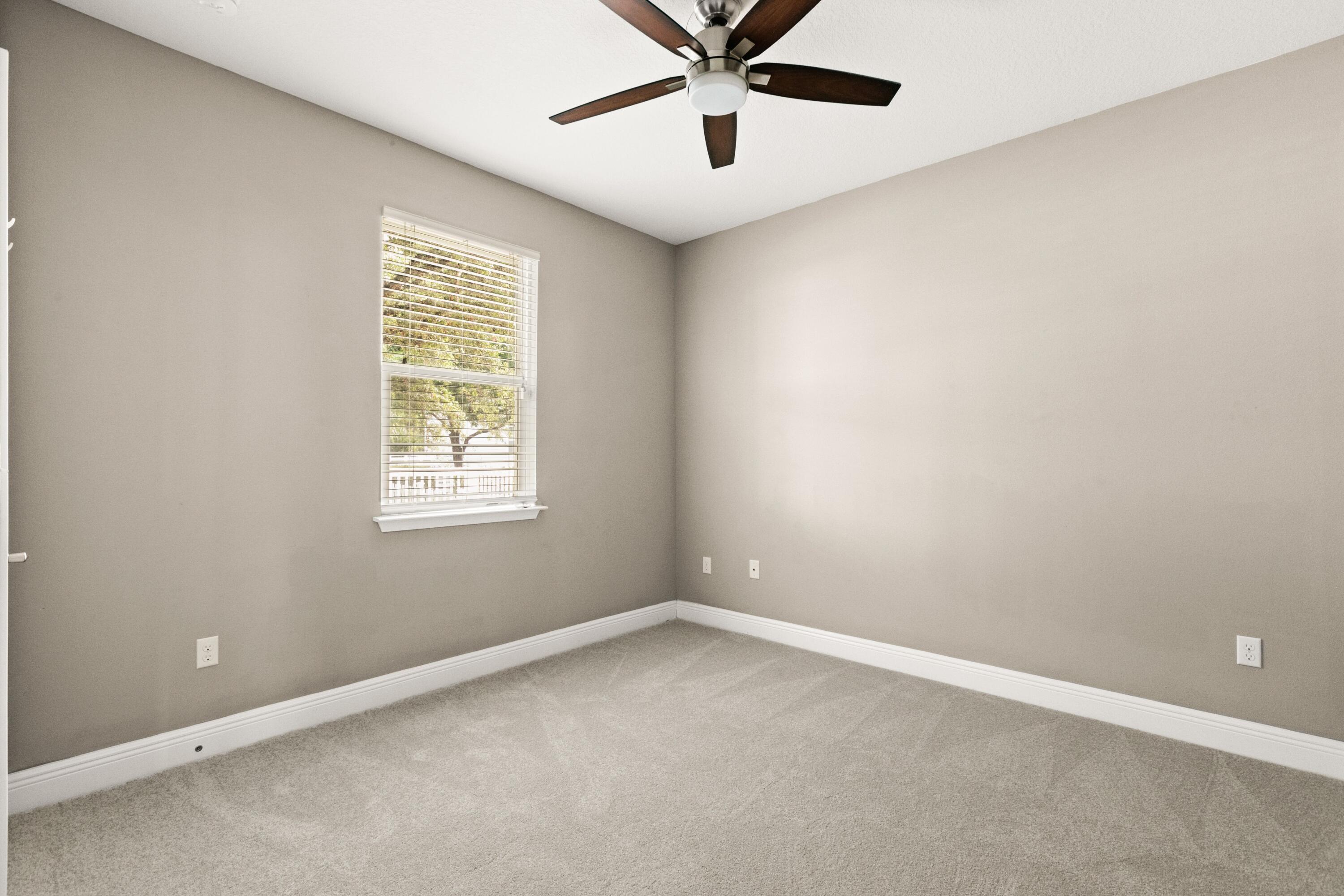 27 Inlet Cove Inlet Beach, FL 32461 - Photo 12 of 31 an empty room with a window and a fan