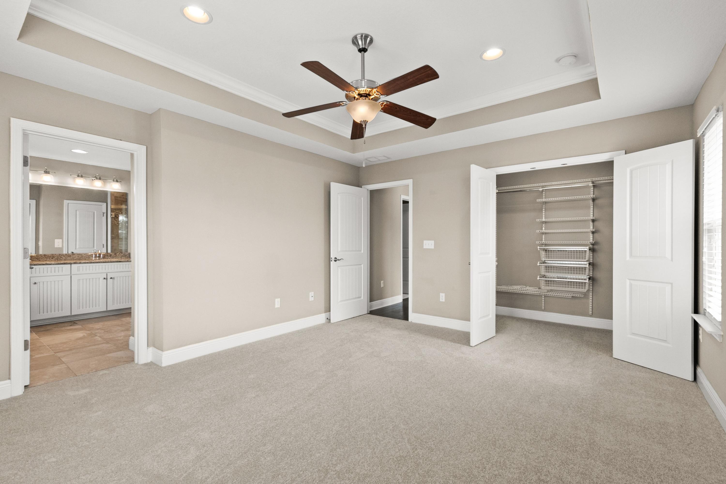 27 Inlet Cove Inlet Beach, FL 32461 - Photo 19 of 31 an empty room with closet and a ceiling fan