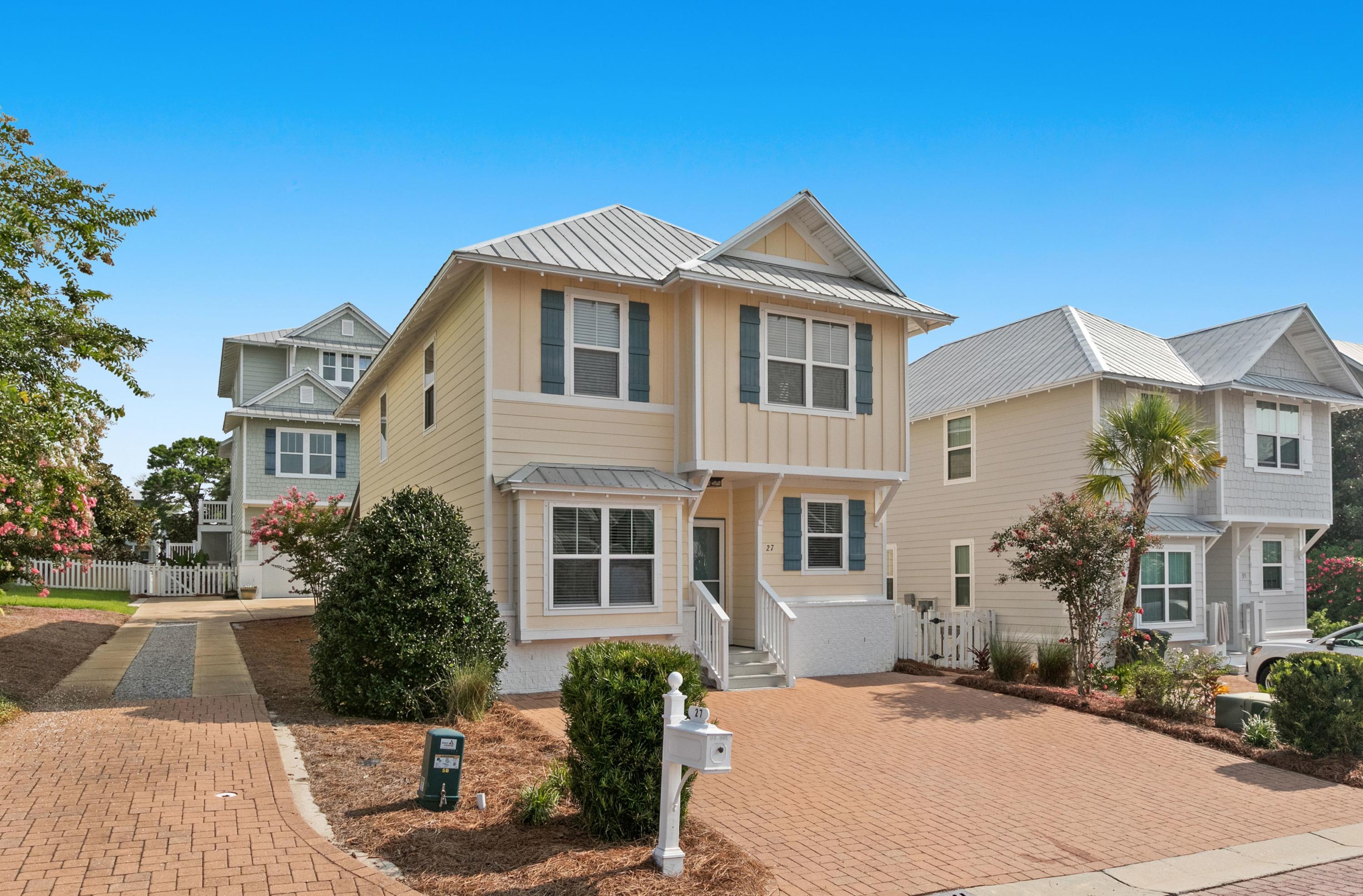 27 Inlet Cove Inlet Beach, FL 32461 - Photo 2 of 31 a front view of a house with a yard