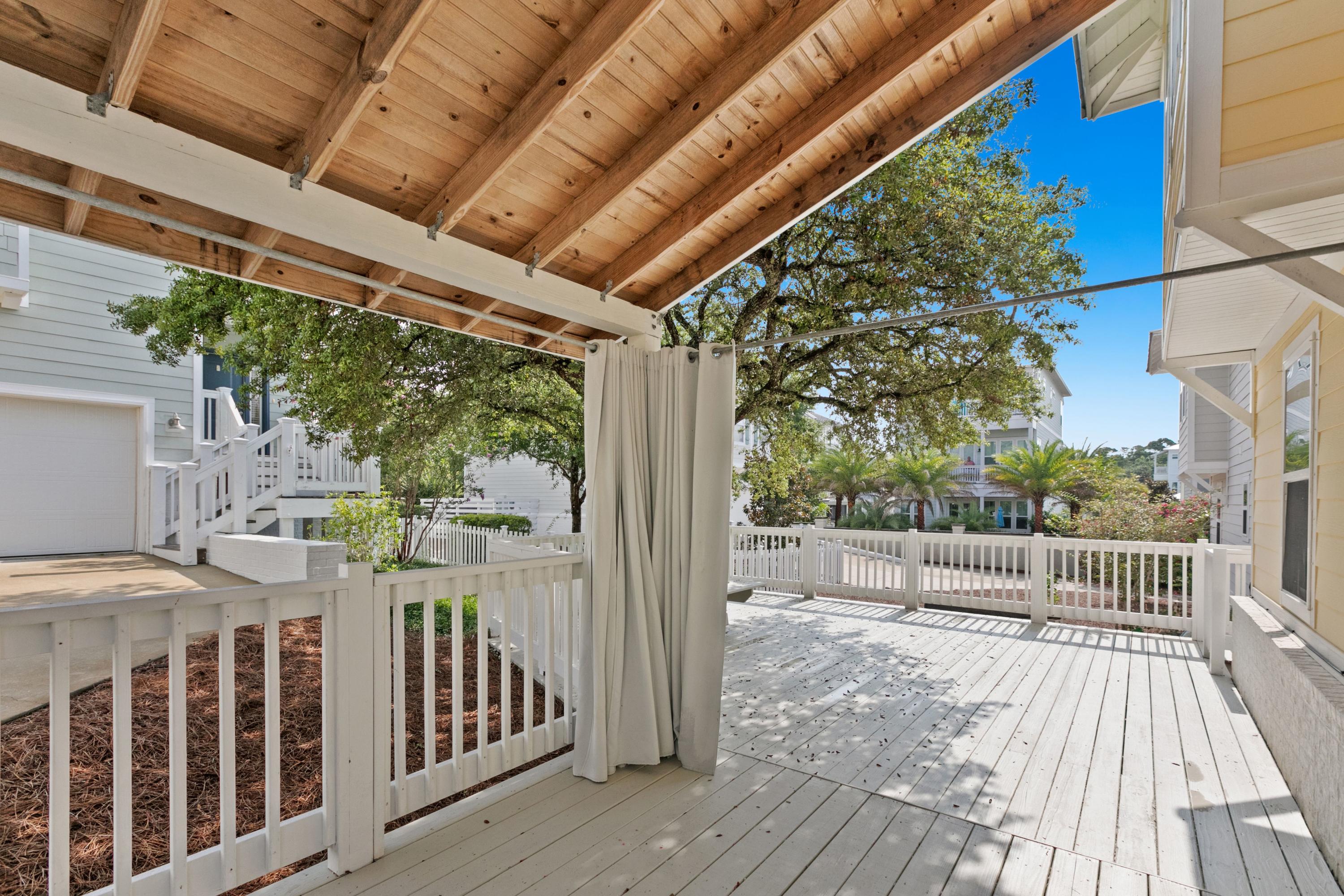 27 Inlet Cove Inlet Beach, FL 32461 - Photo 24 of 31 a view of a porch with wooden floor and iron fence