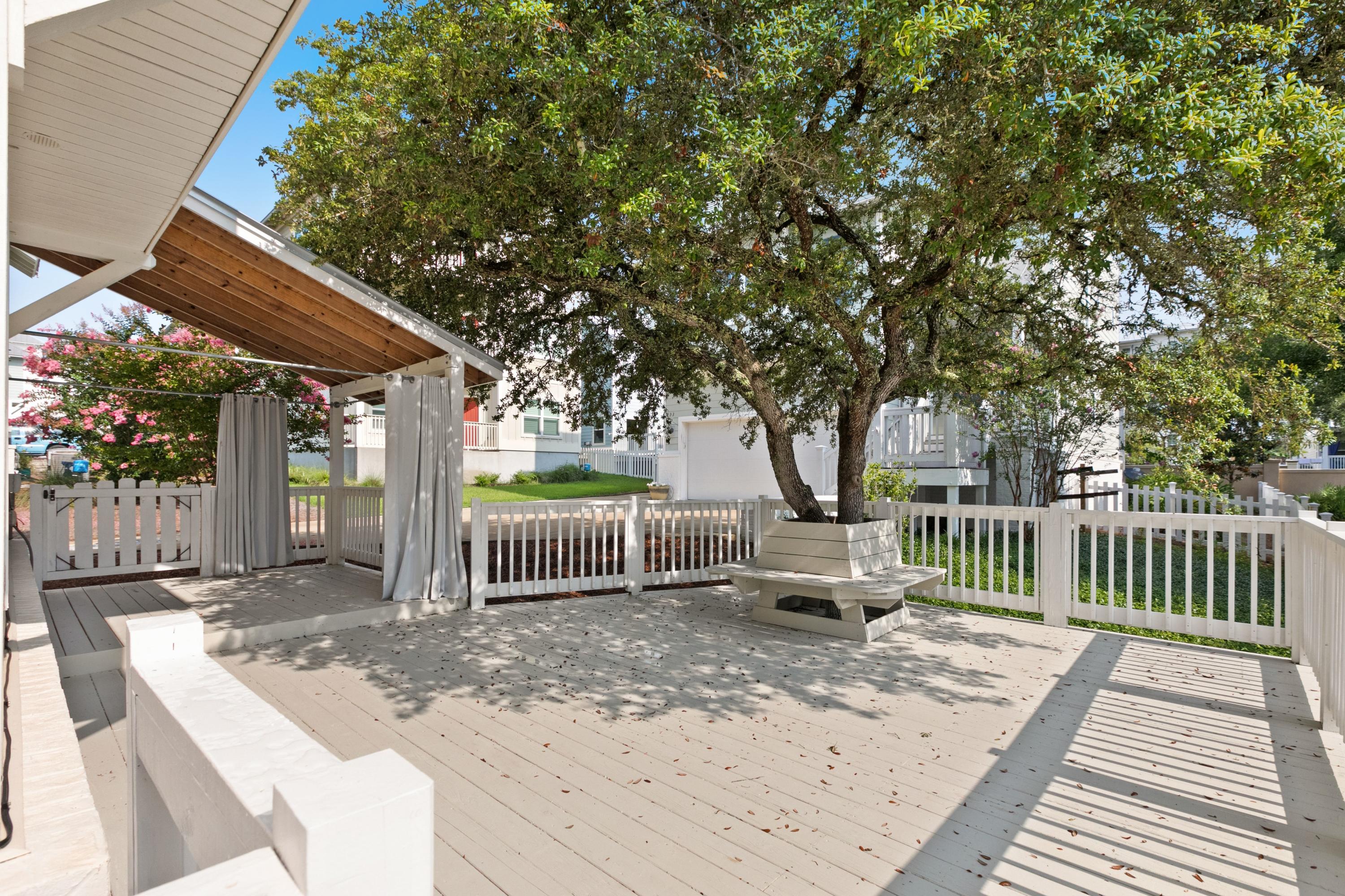 27 Inlet Cove Inlet Beach, FL 32461 - Photo 26 of 31 a backyard of a house with fountain table and chairs