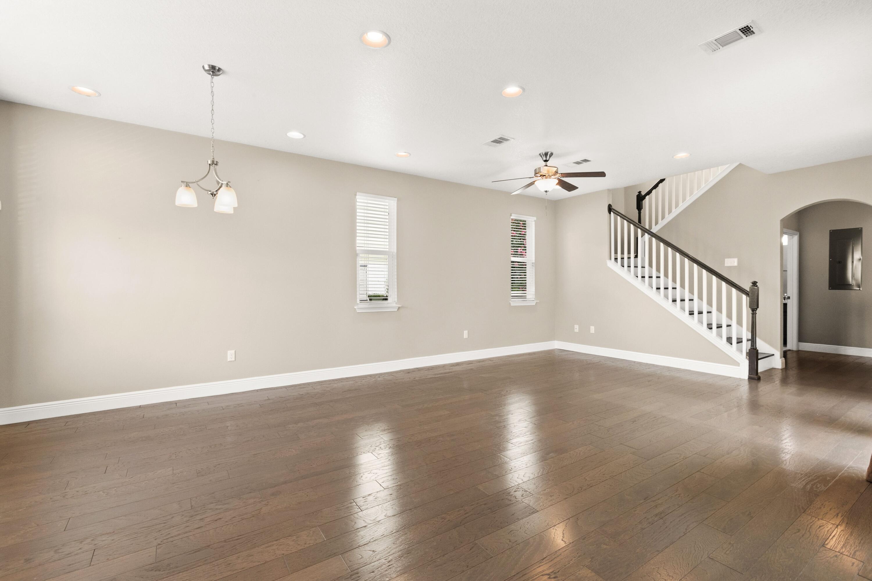 27 Inlet Cove Inlet Beach, FL 32461 - Photo 9 of 31 a view of an empty room with wooden floor and a ceiling fan