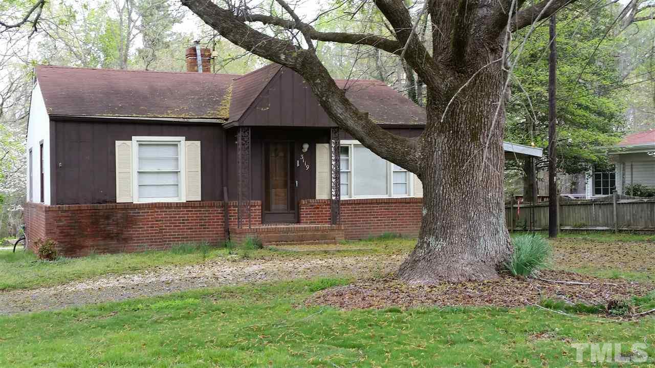 3119 Cheek Road Durham, NC 27704 - Photo 4 of 6 a front view of house with a garden