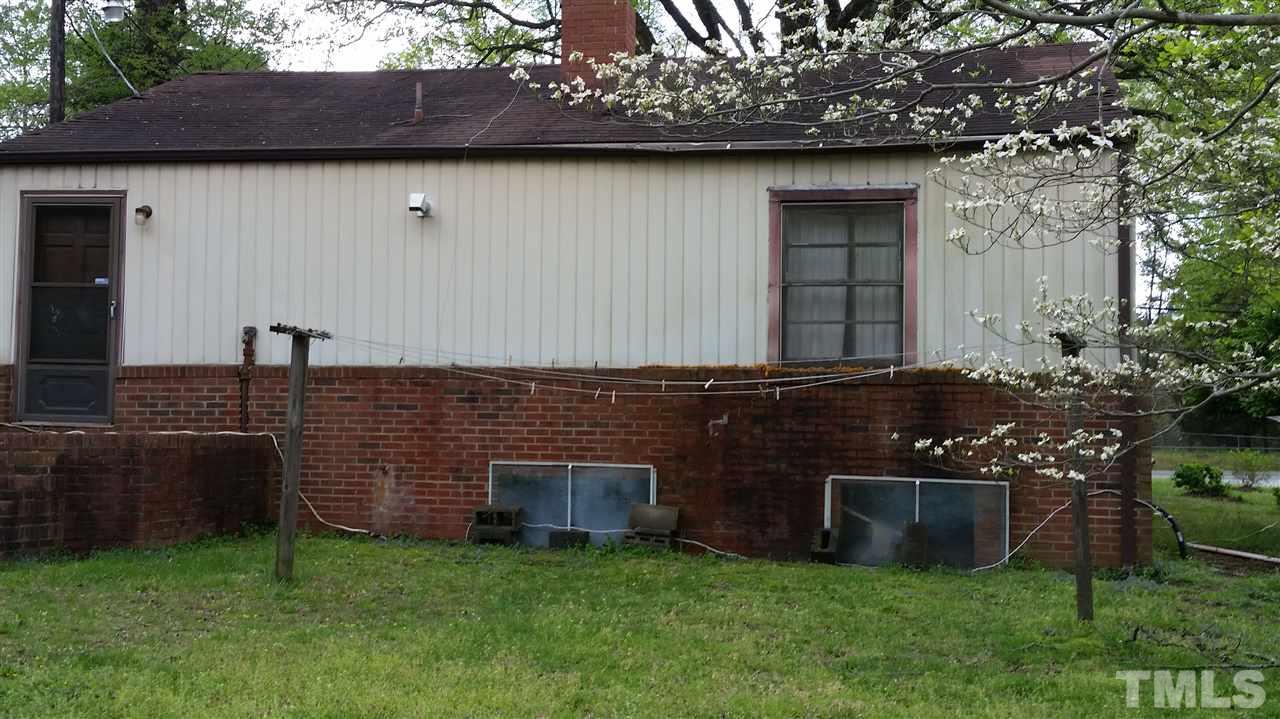 3119 Cheek Road Durham, NC 27704 - Photo 5 of 6 a front view of a house with a yard