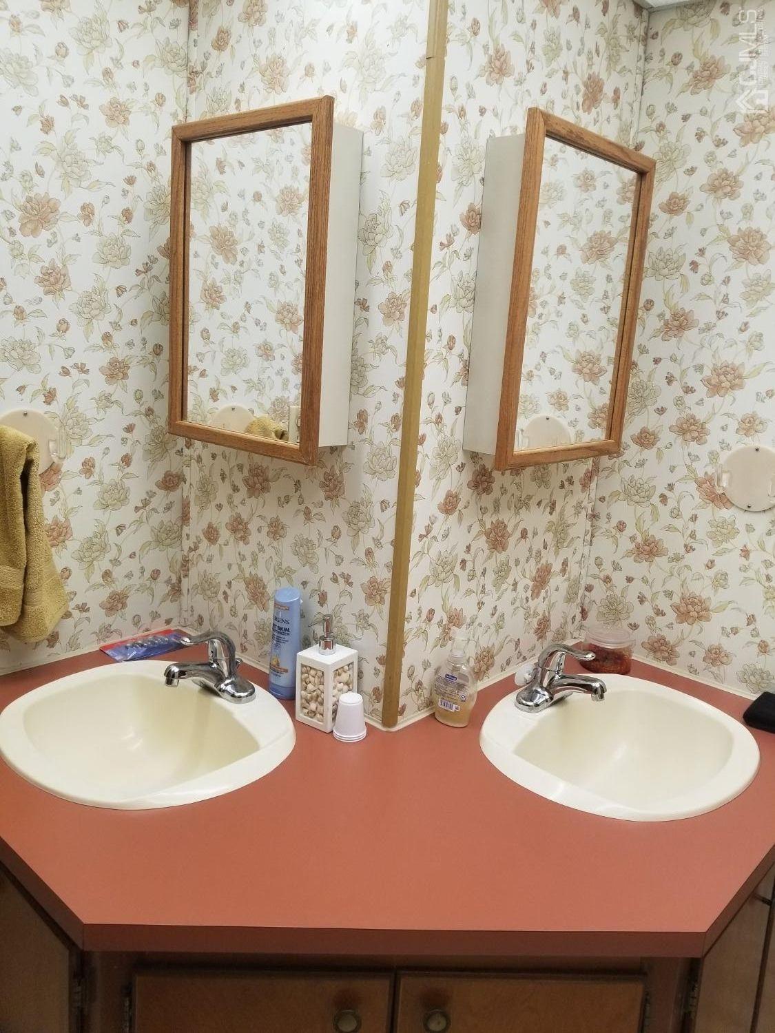 11 Whitman Road North Brunswick, NJ 08902 - Photo 22 of 32 a bathroom with a sink and a mirror