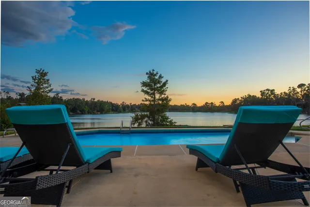 a view of a ocean with a couple of chairs