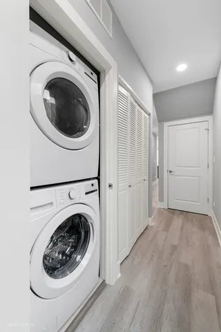 a view of a hallway with washer and dryer
