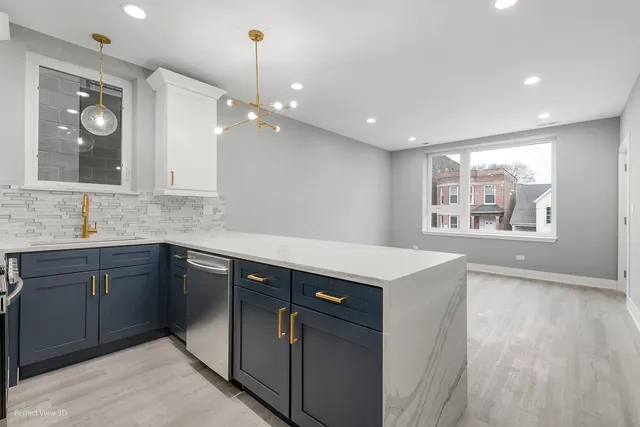 a kitchen with a stove and a sink
