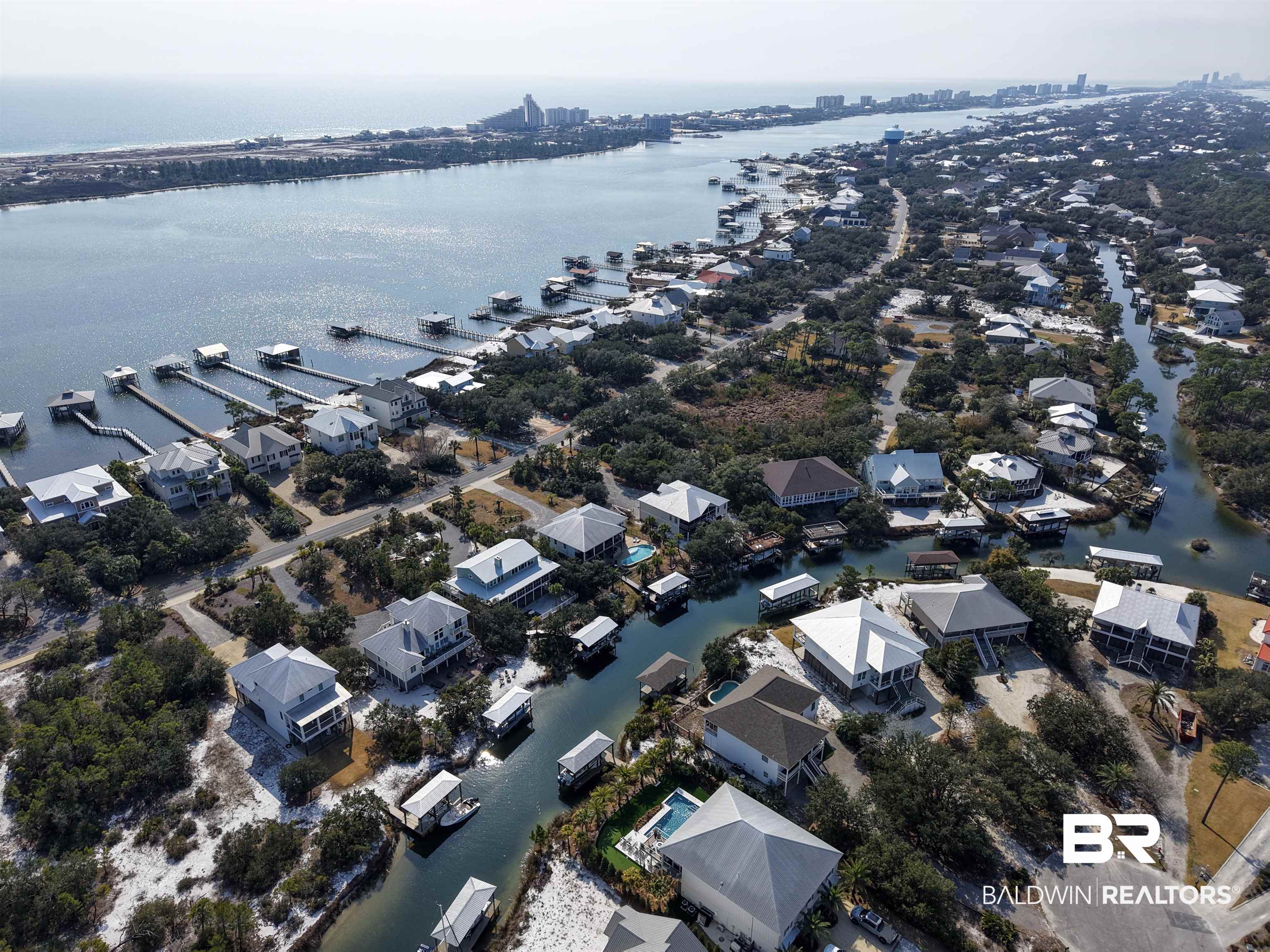 32191 River Road Orange Beach, AL 36561 - Photo 39 of 46 Aerial view of residential area with a nearby body of water