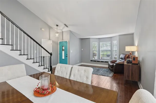 a living room with furniture fireplace and a window