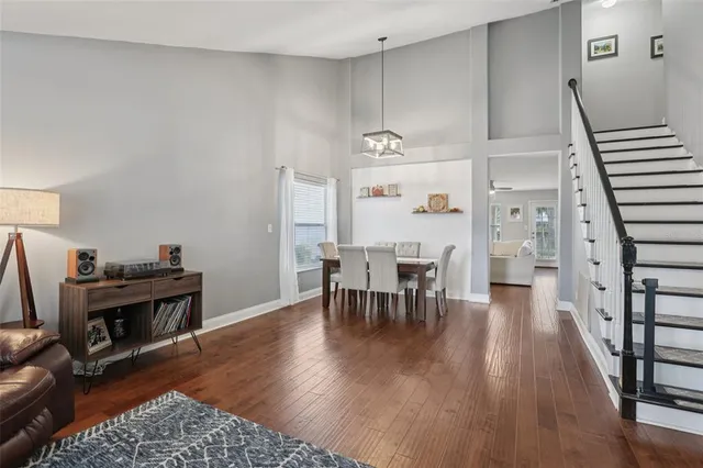 a view of a livingroom with furniture and hardwood floor
