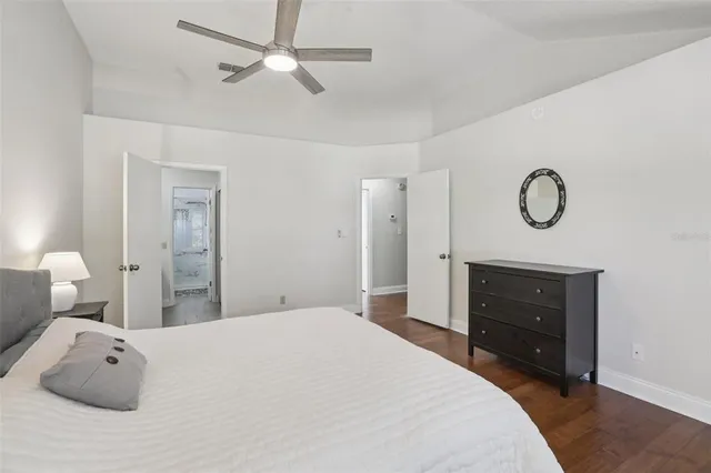 a bedroom with a bed and cabinets