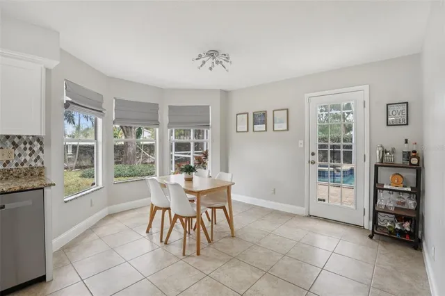 a dining room with furniture and window