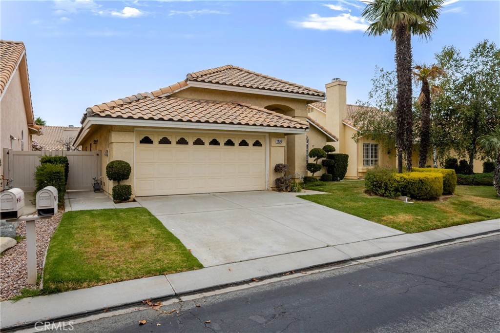 680 Indian Wells Road Banning, CA 92220 - Photo 4 of 37 a front view of a house with garden