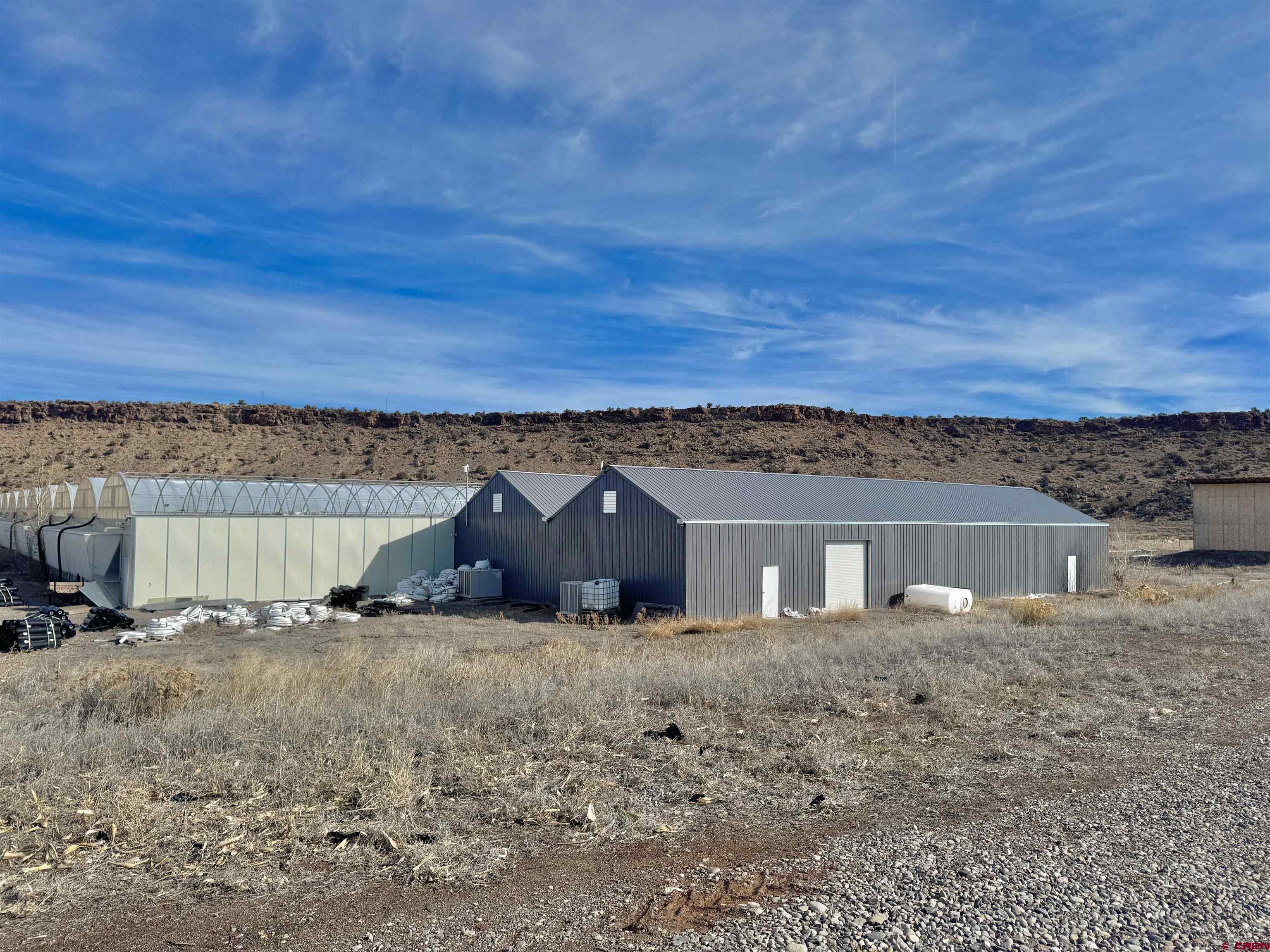 16267 Shavano Valley Road Montrose, CO 81403 - Photo 1 of 9 a view of a house with a yard