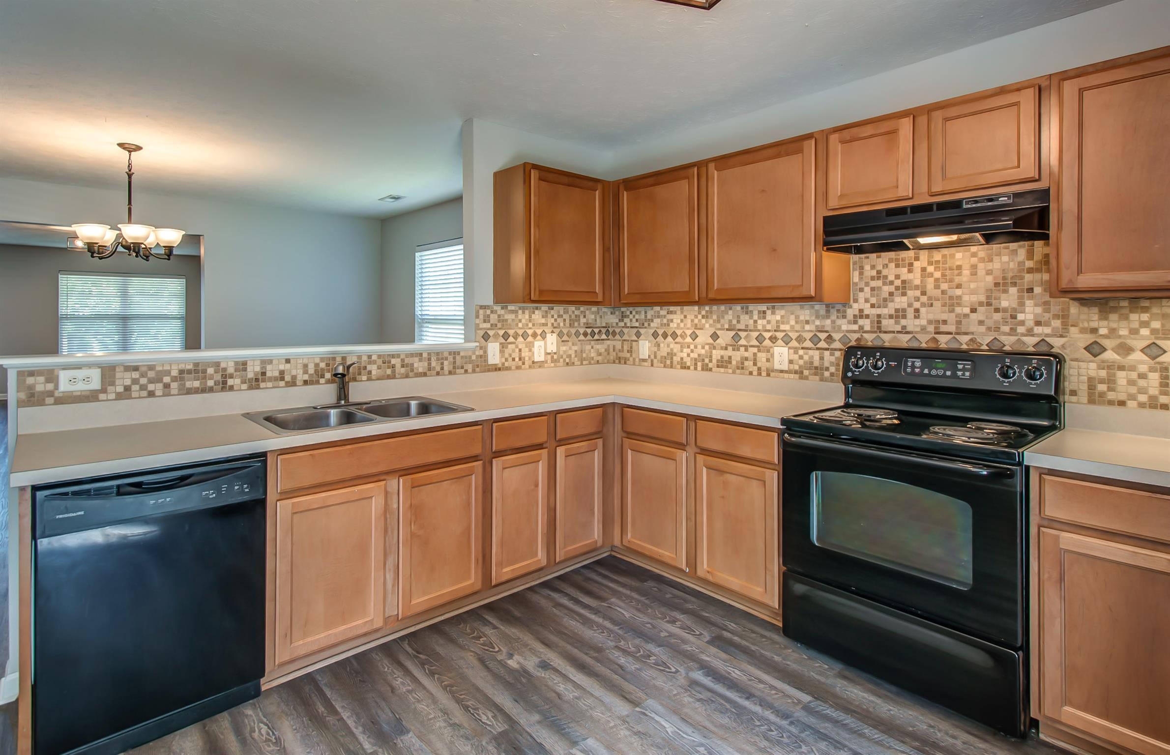 3969 Stephens Ridge Way Antioch, TN 37013 - Photo 6 of 29 a kitchen with a sink stove and cabinets