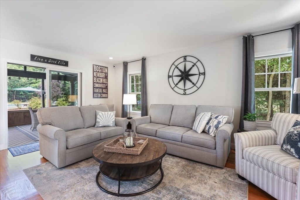 22 Constitution Way Hanson, MA 02341 - Photo 12 of 40 a living room with furniture a table and a large window