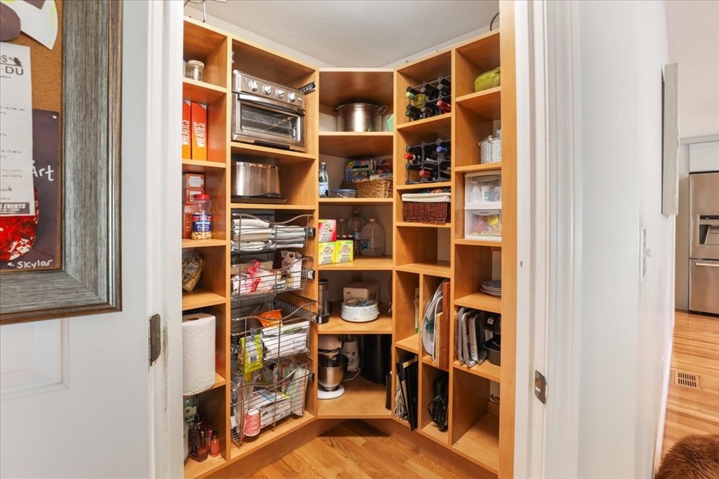 22 Constitution Way Hanson, MA 02341 - Photo 17 of 40 a view of living room with closet and racks