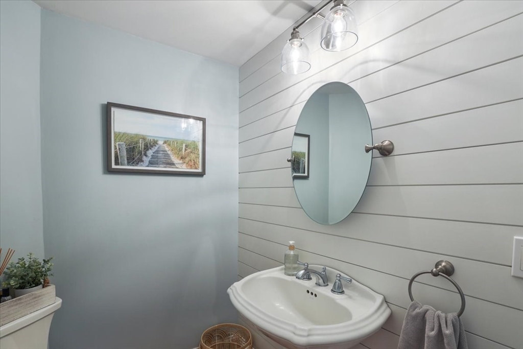22 Constitution Way Hanson, MA 02341 - Photo 20 of 40 a bathroom with a sink mirror and toilet