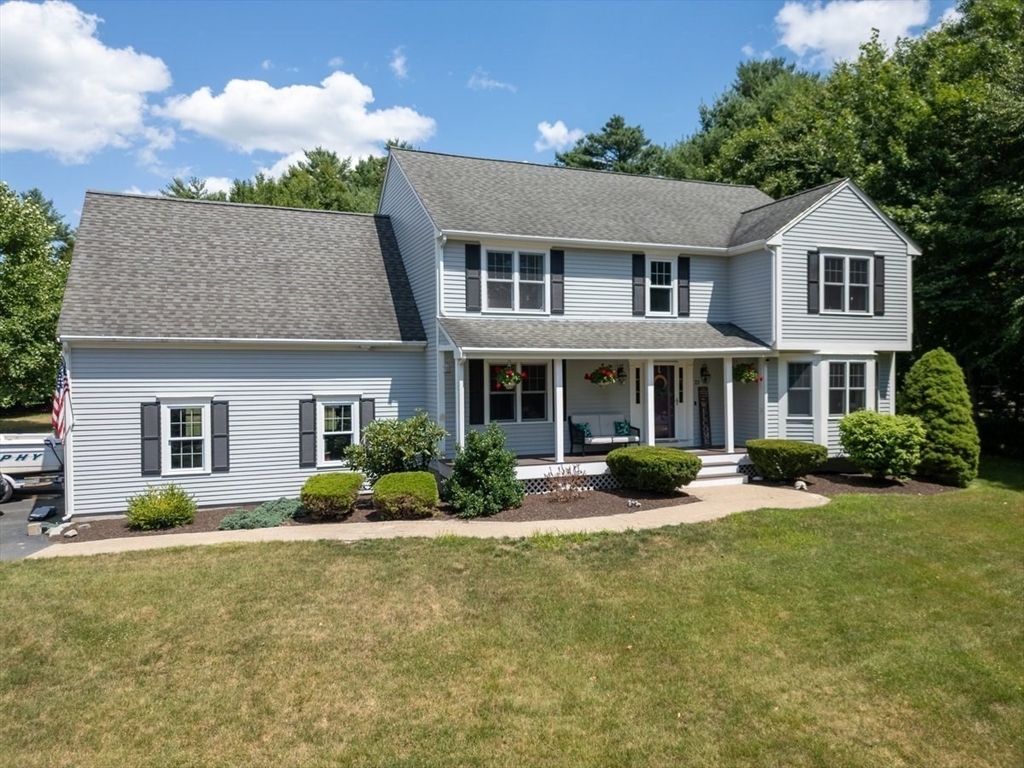 22 Constitution Way Hanson, MA 02341 - Photo 2 of 40 a front view of a house with yard and green space