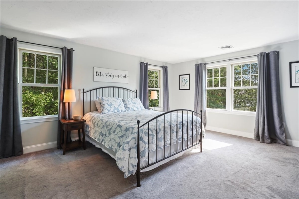 22 Constitution Way Hanson, MA 02341 - Photo 21 of 40 a bedroom with a bed and a window