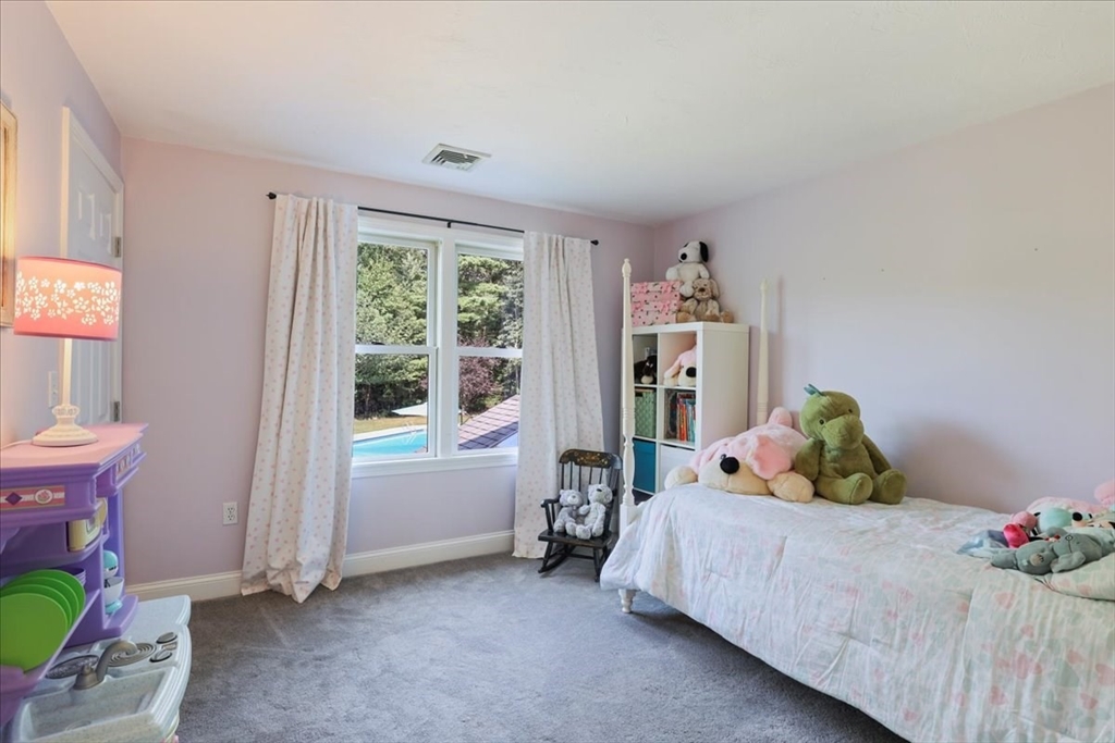 22 Constitution Way Hanson, MA 02341 - Photo 26 of 40 a bedroom with a bed and large window