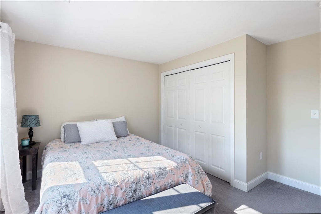 22 Constitution Way Hanson, MA 02341 - Photo 29 of 40 a bedroom with a bed and a window