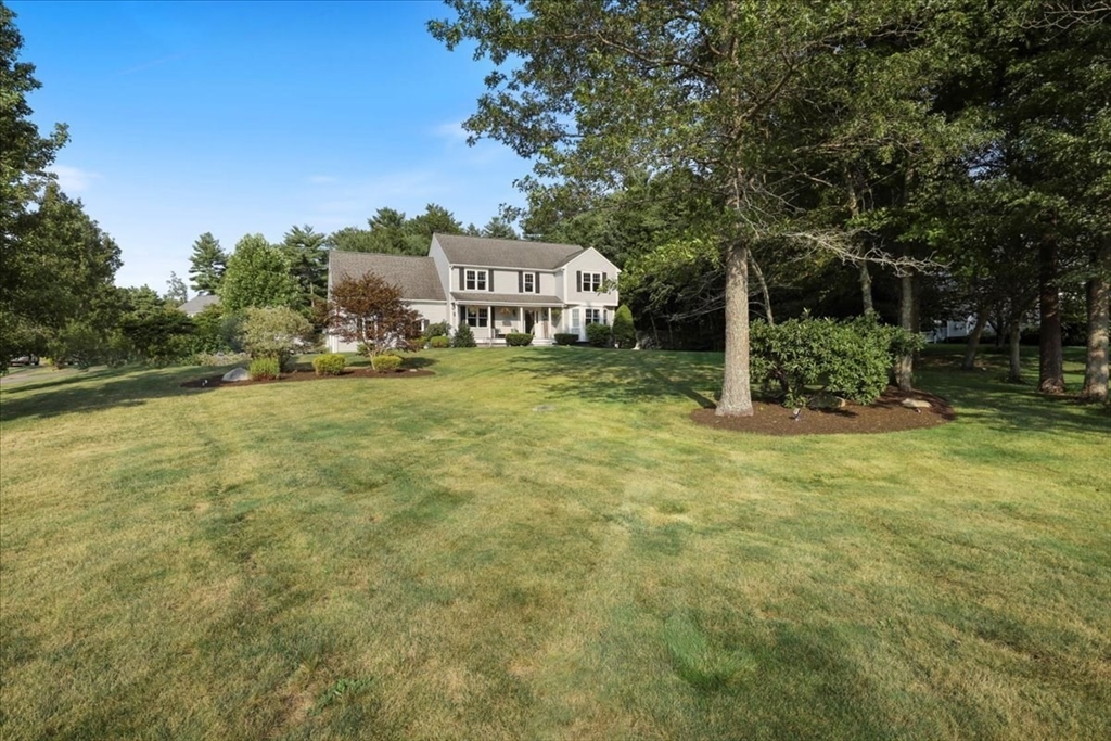 22 Constitution Way Hanson, MA 02341 - Photo 3 of 40 a front view of a house with a yard