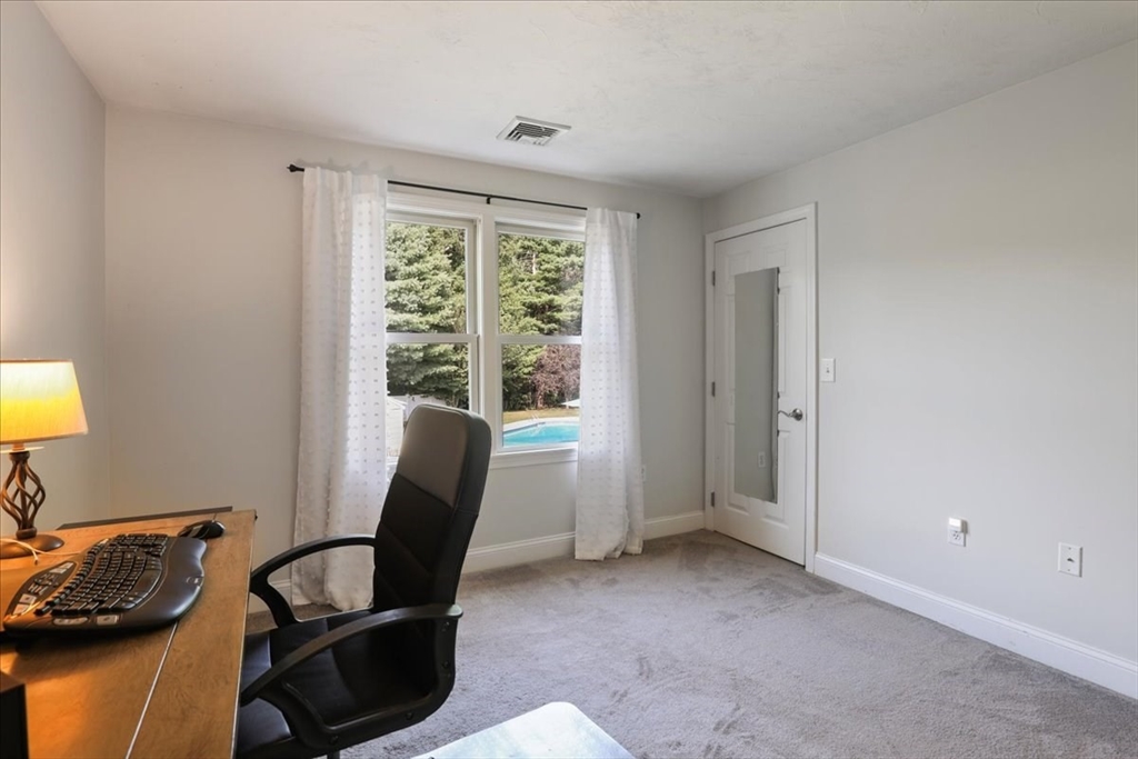 22 Constitution Way Hanson, MA 02341 - Photo 33 of 40 a room with furniture and a window