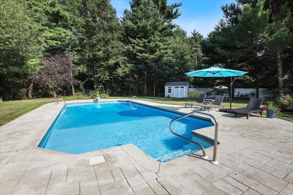 22 Constitution Way Hanson, MA 02341 - Photo 37 of 40 a swimming pool with outdoor seating yard and barbeque oven