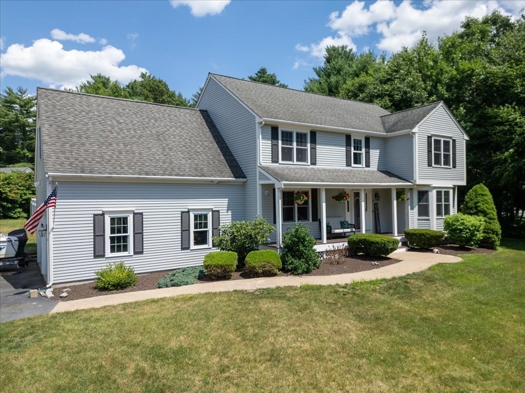 22 Constitution Way Hanson, MA 02341 - Photo 4 of 40 a front view of a house with garden