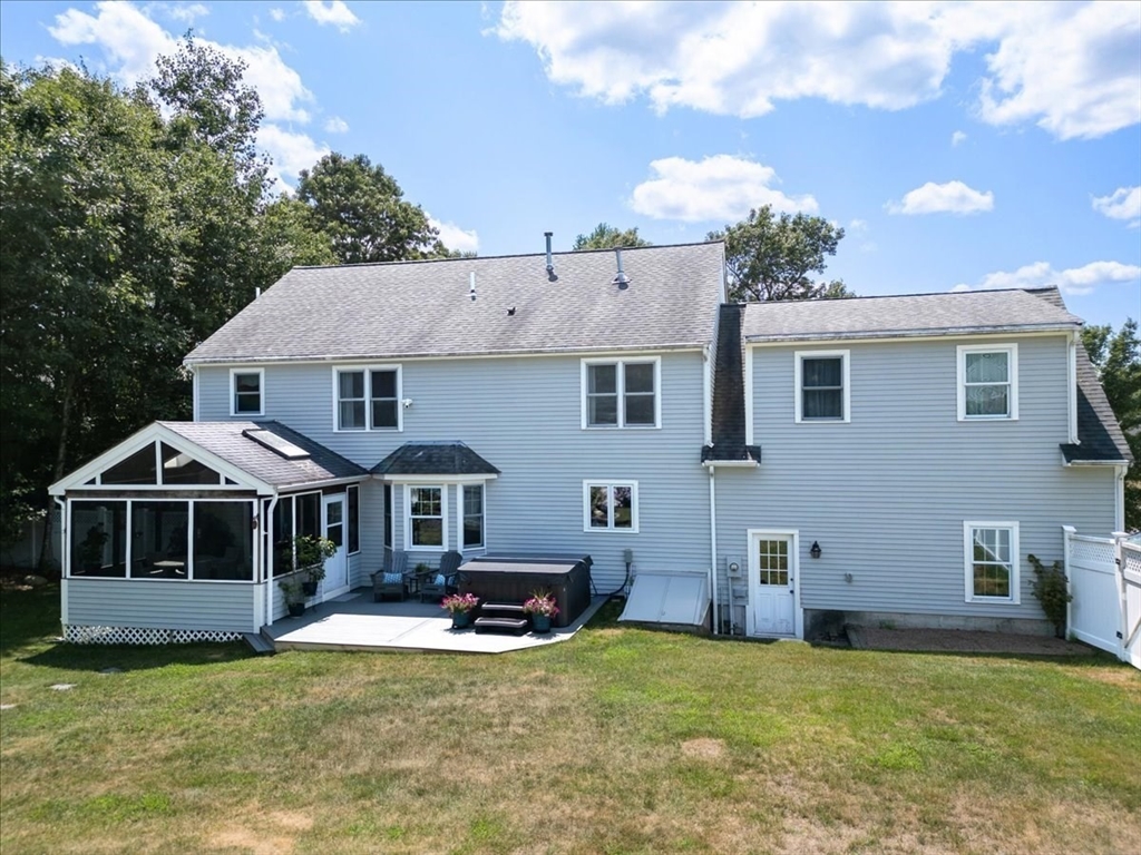 22 Constitution Way Hanson, MA 02341 - Photo 5 of 40 a front view of a house with a yard