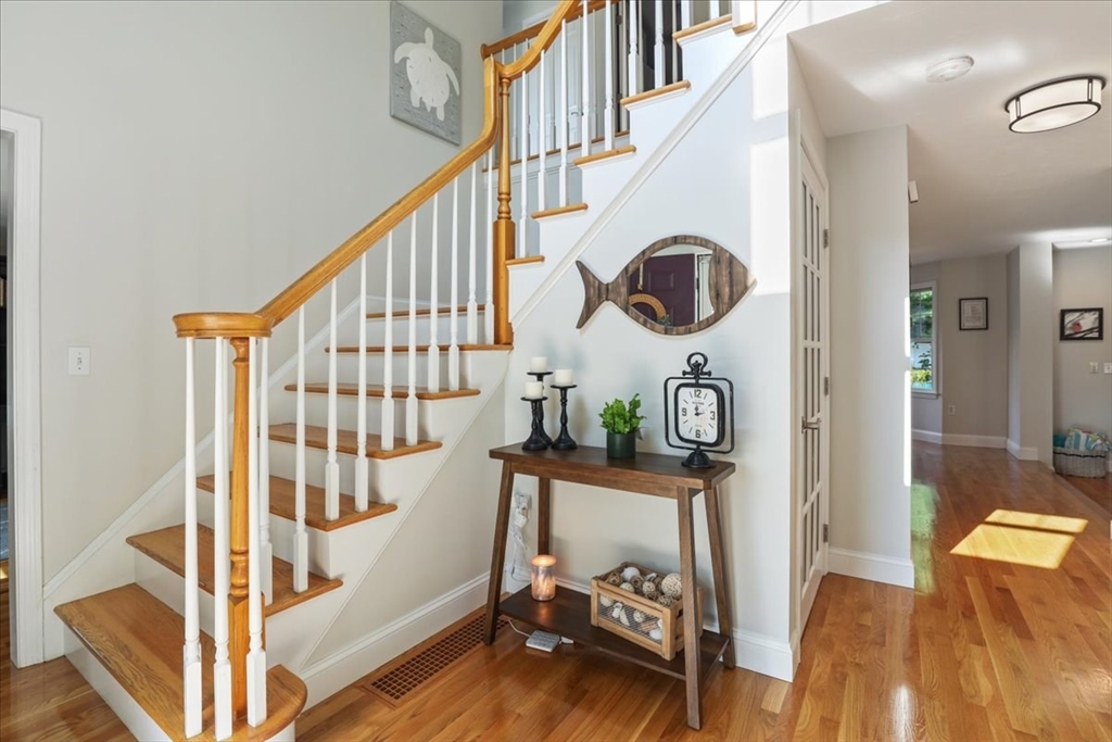 22 Constitution Way Hanson, MA 02341 - Photo 9 of 40 a view of entryway livingroom and hall