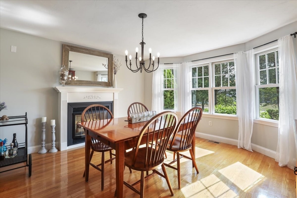 22 Constitution Way Hanson, MA 02341 - Photo 10 of 40 a view of a dining room with furniture window and wooden floor
