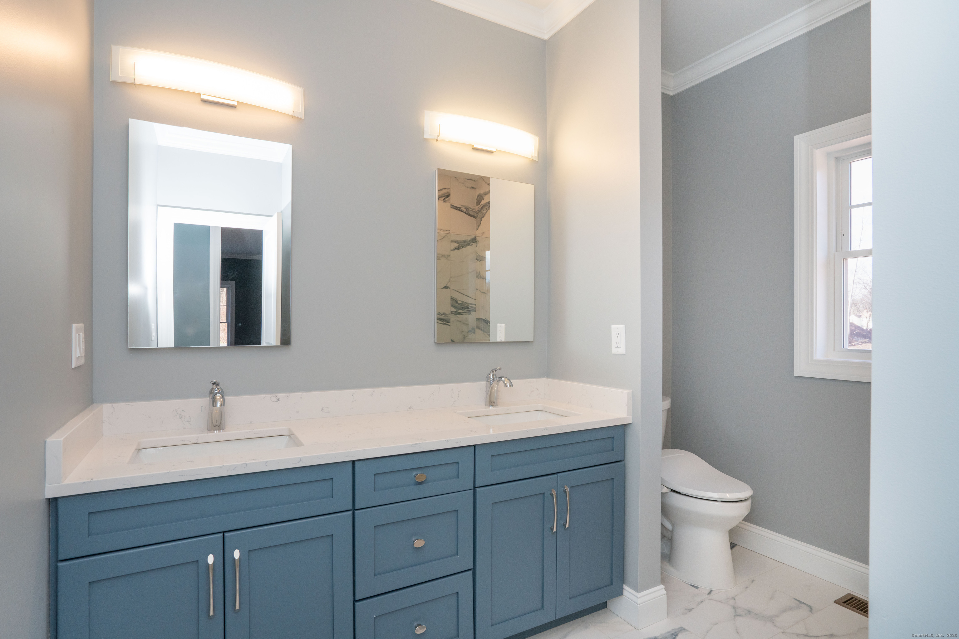 963 High Road Berlin, CT 06037 - Photo 11 of 39 a bathroom with a toilet a sink and mirror