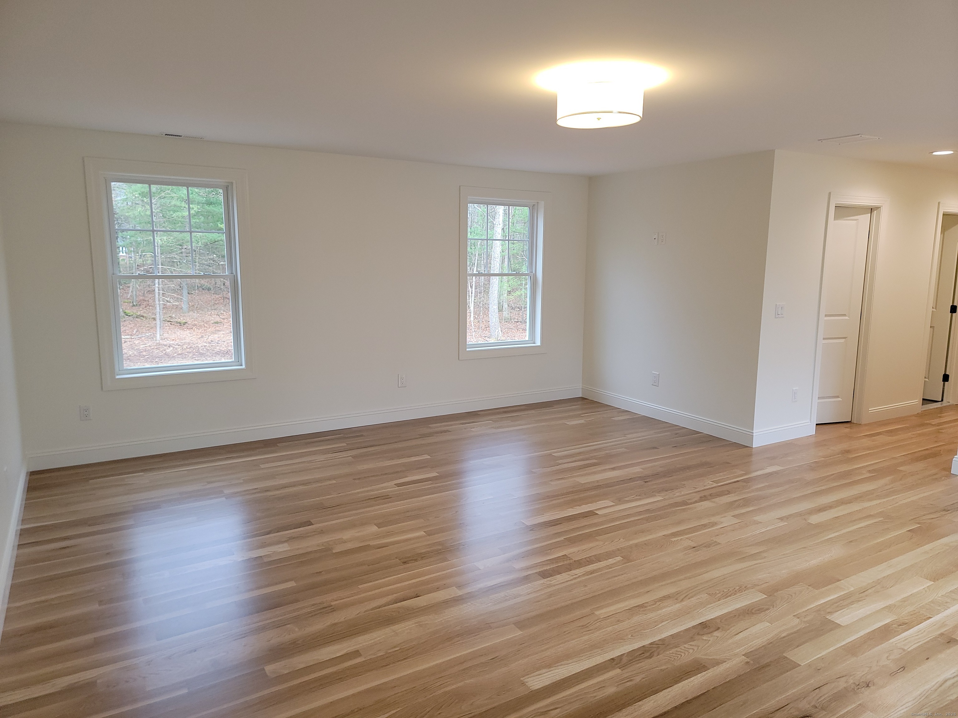 963 High Road Berlin, CT 06037 - Photo 12 of 39 an empty room with wooden floor and windows