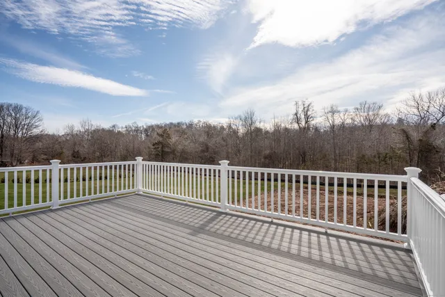 a view of balcony with wooden floor