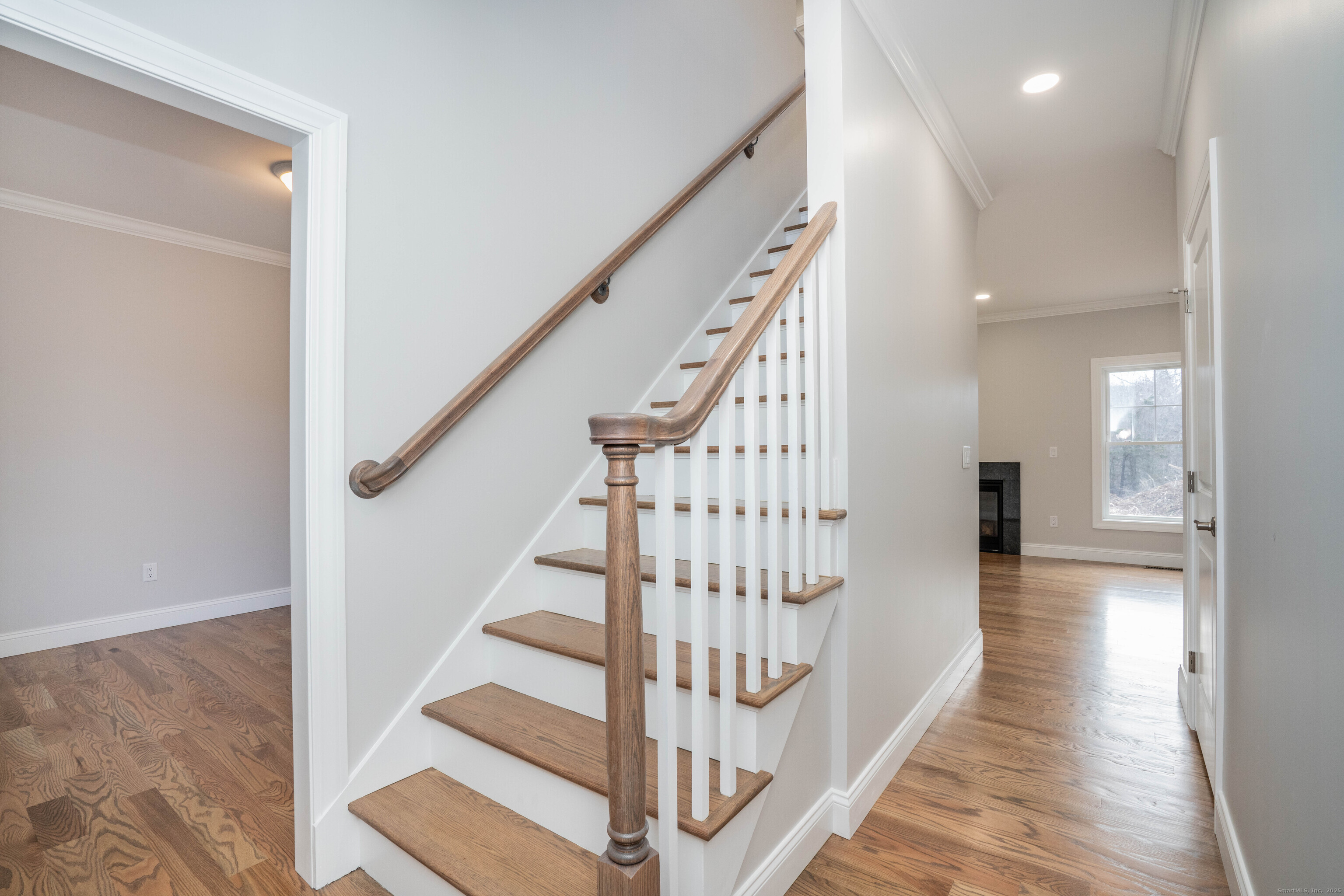 963 High Road Berlin, CT 06037 - Photo 25 of 39 a view of staircase with lots of frames on wall and wooden floor