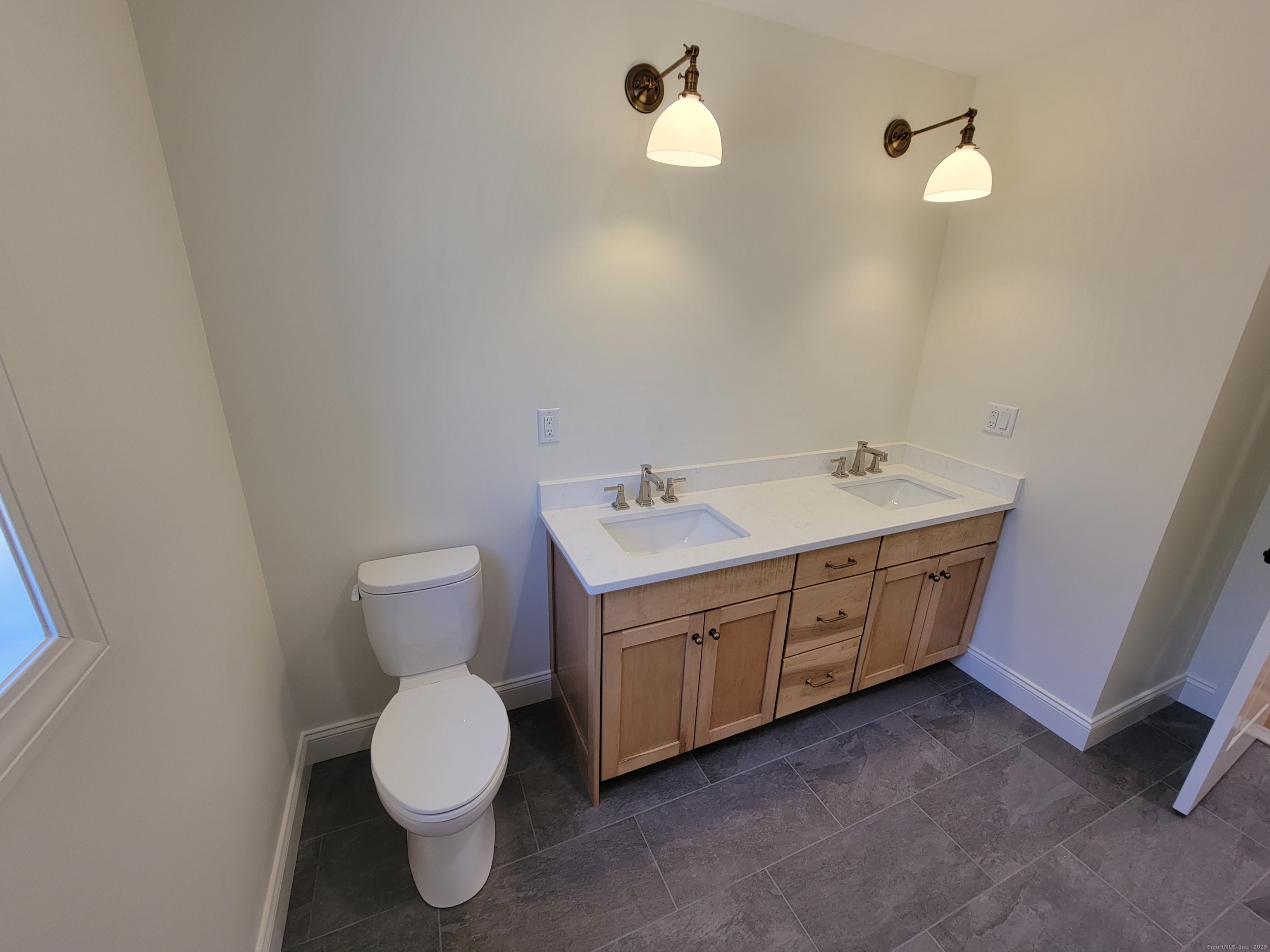 963 High Road Berlin, CT 06037 - Photo 25 of 39 a bathroom with a toilet sink and mirror