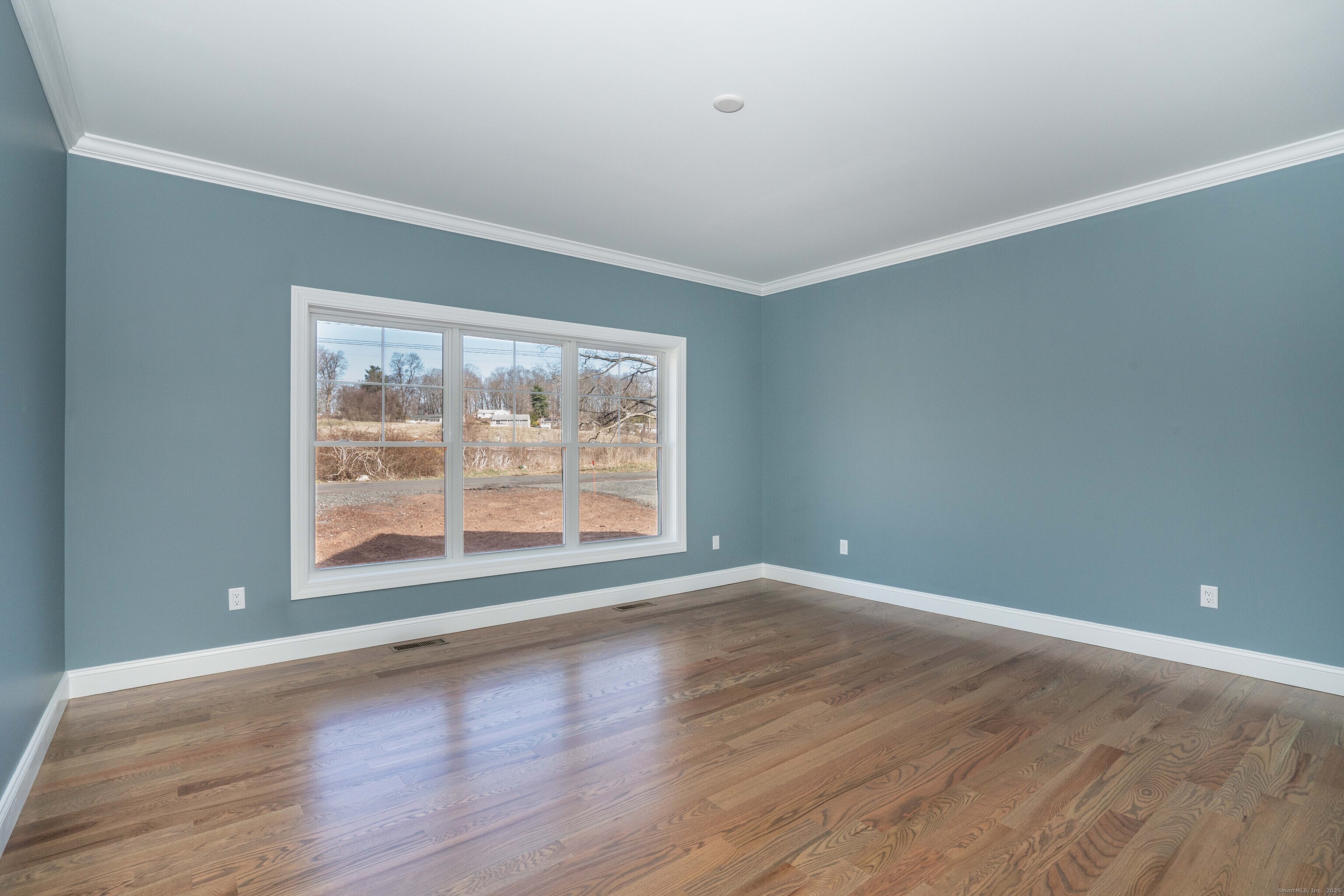963 High Road Berlin, CT 06037 - Photo 8 of 39 an empty room with wooden floor and windows