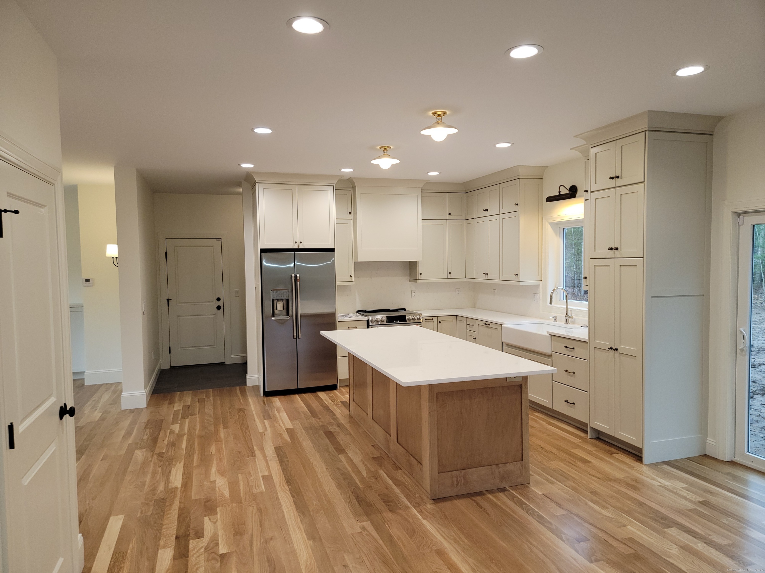 963 High Road Berlin, CT 06037 - Photo 10 of 39 a large kitchen with a large counter top a sink stainless steel appliances and cabinets
