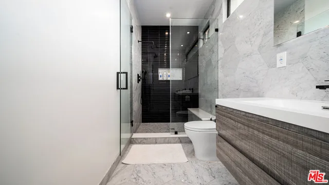 a bathroom with a bathtub and a toilet