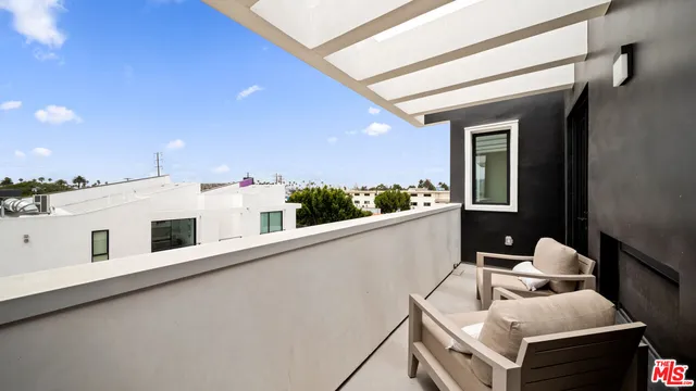 a view of balcony with furniture