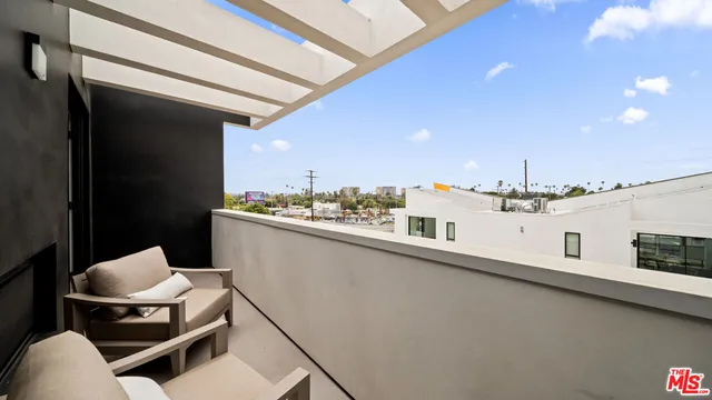 a kitchen with stainless steel appliances a sink and cabinets