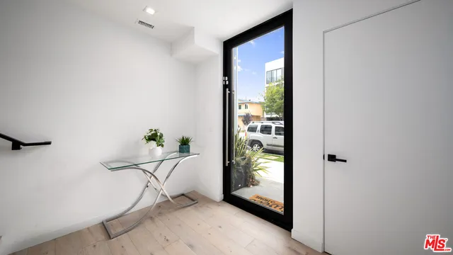 a potted plant sitting on the side of a building