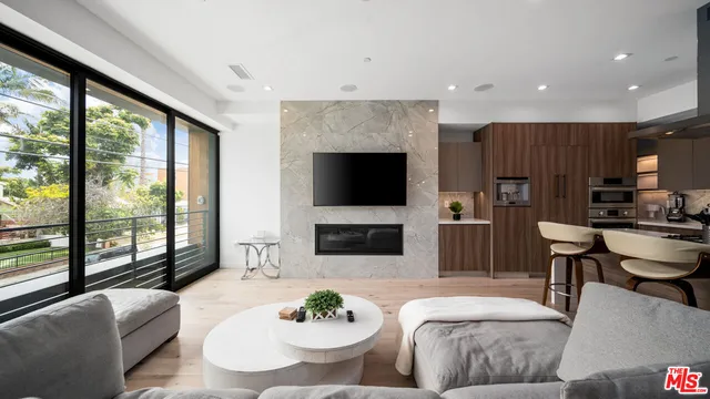 a living room with fireplace furniture and a flat screen tv